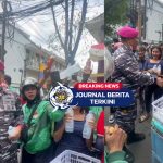 [VIDEO] Kepala Dinas Penerangan Korps Marinir Mentraktir Minuman Sejumlah Pengemudi Ojol dan Warga